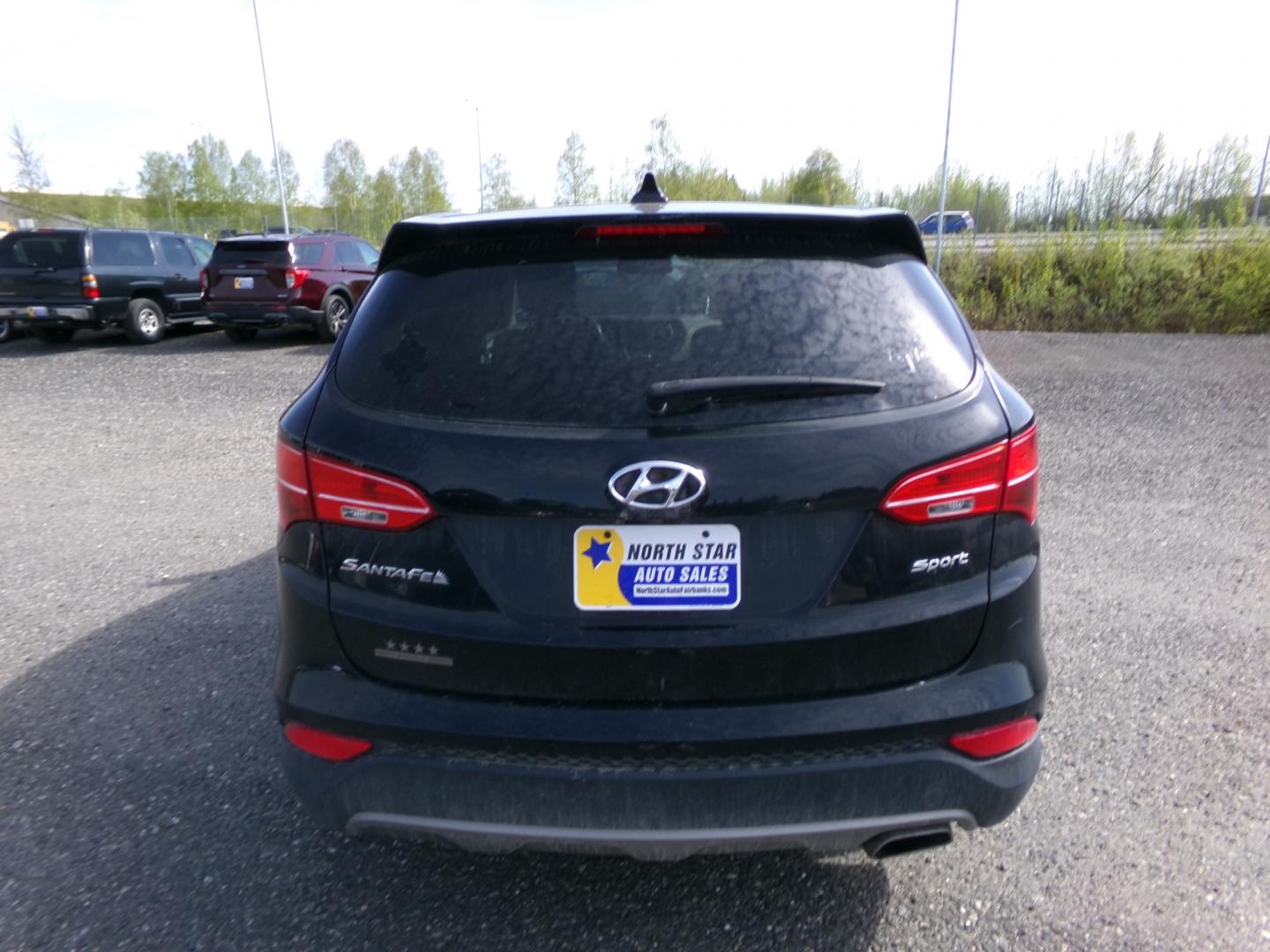 2013 Black Hyundai Santa Fe Sport 2.4 FWD (5XYZU3LB9DG) with an 2.4L L4 DOHC 16V engine, 6-Speed Automatic transmission, located at 2630 Philips Field Rd., Fairbanks, AK, 99709, (907) 458-0593, 64.848068, -147.780609 - Photo#3